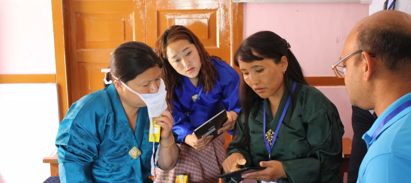 Photograph of 3 women taking part in the design research process in Bhutan